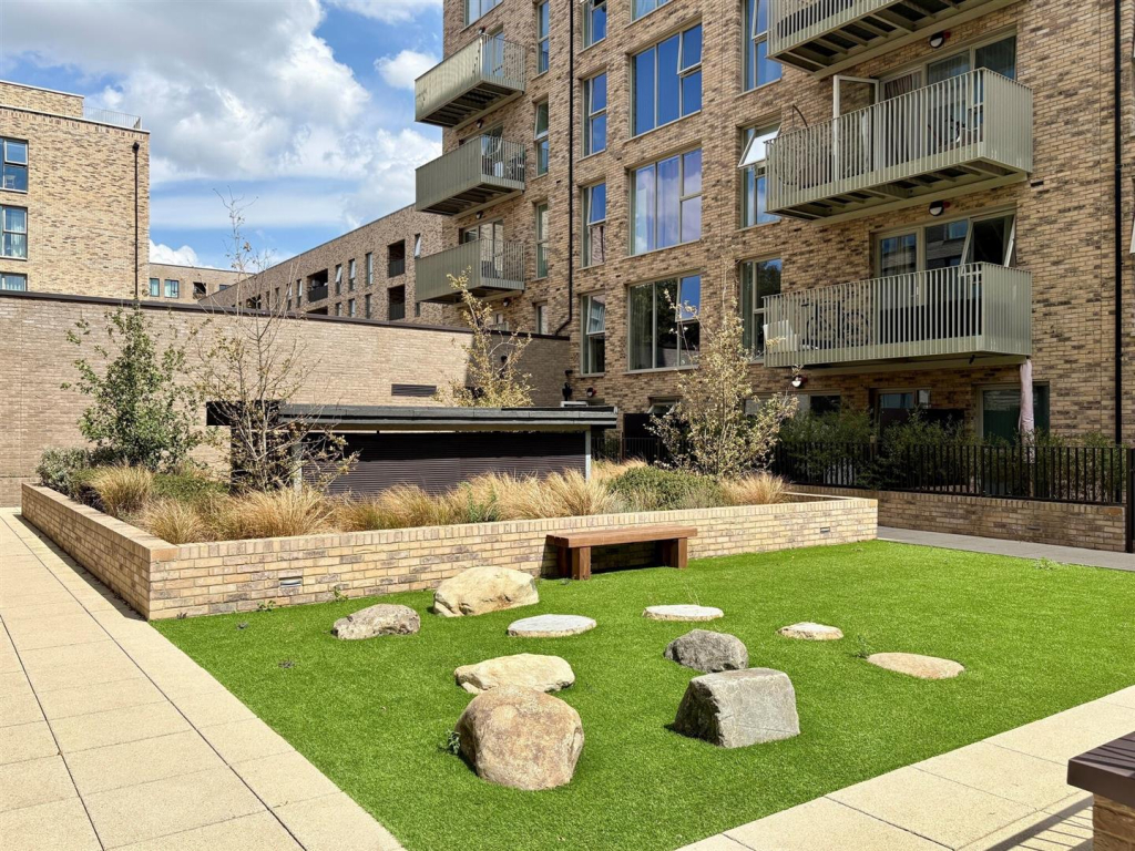 Residential courtyard with garden and seating area