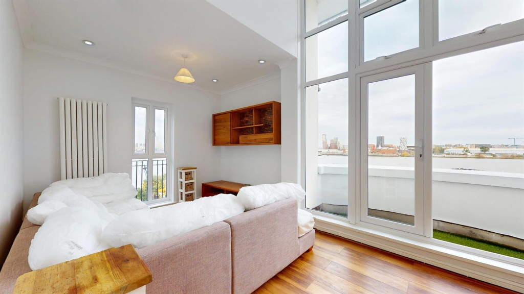 Modern living room with river views and tall windows