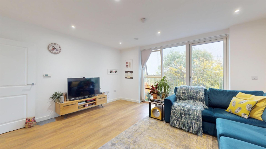 Open-plan living room with French doors